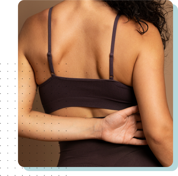 Back view of a woman showing smooth and glowing skin.